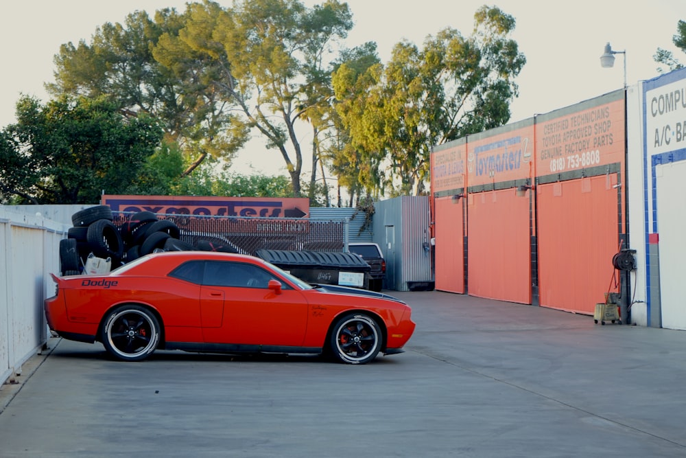 red ferrari 458 italia parked near building