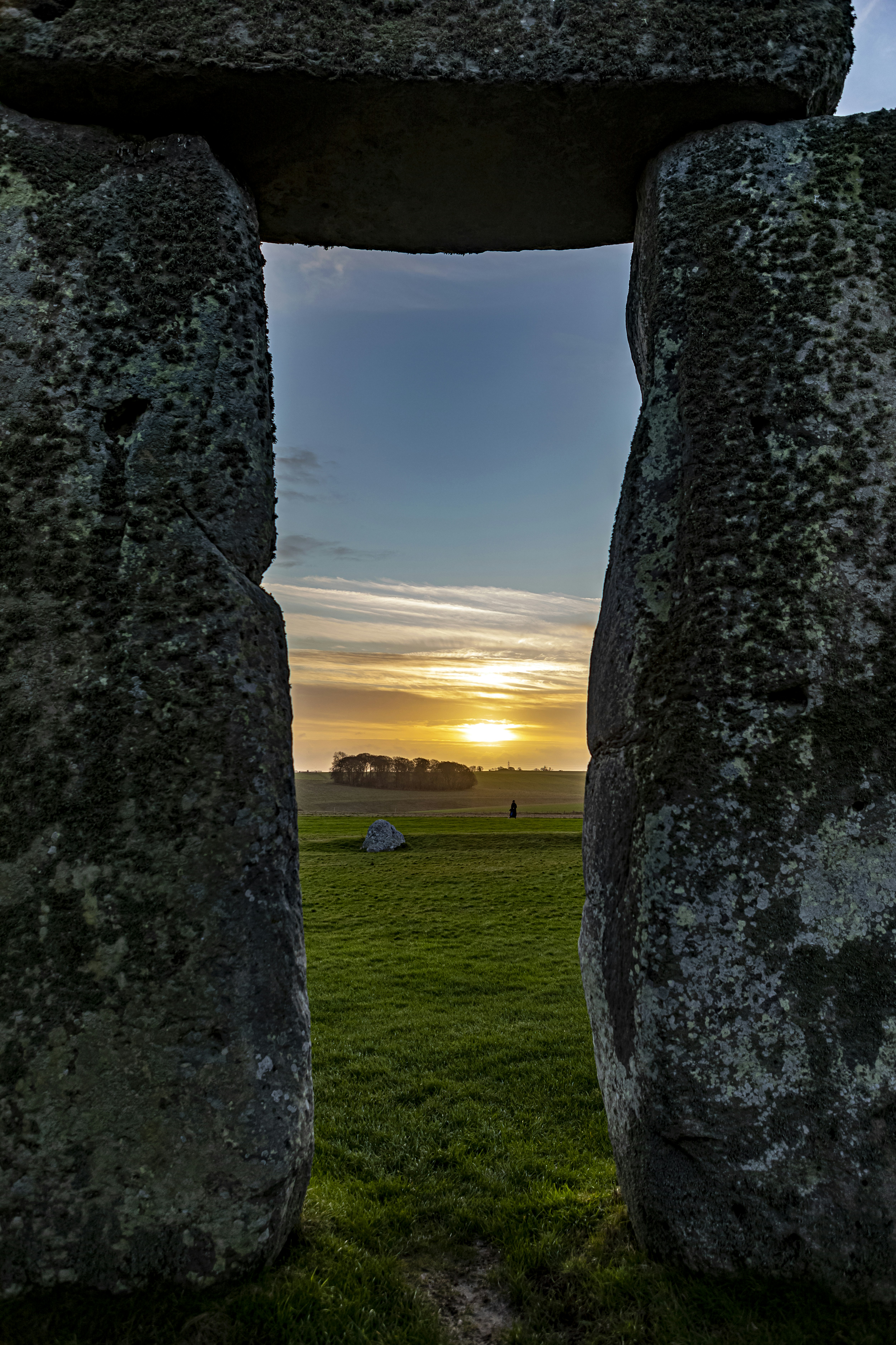 Prehistoric ritual site of Stonehenge with monliths - large stone slabs in rural England, UK. February 2020. Sunrise time.