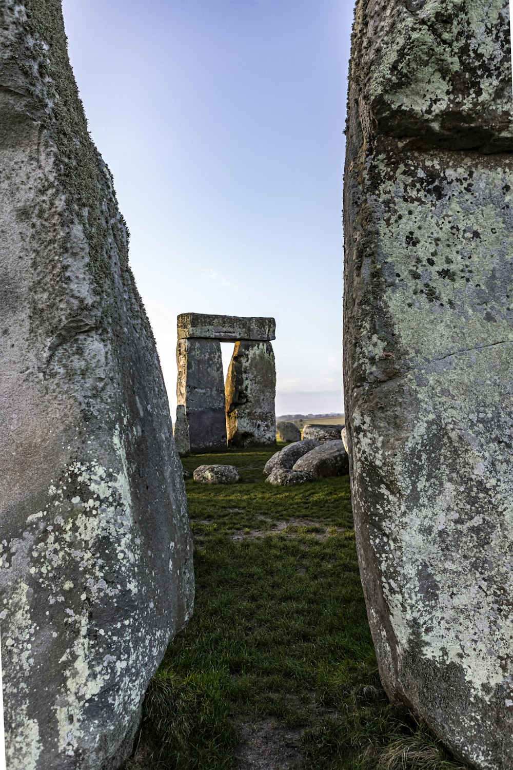 gray rock formation on green grass field during daytime