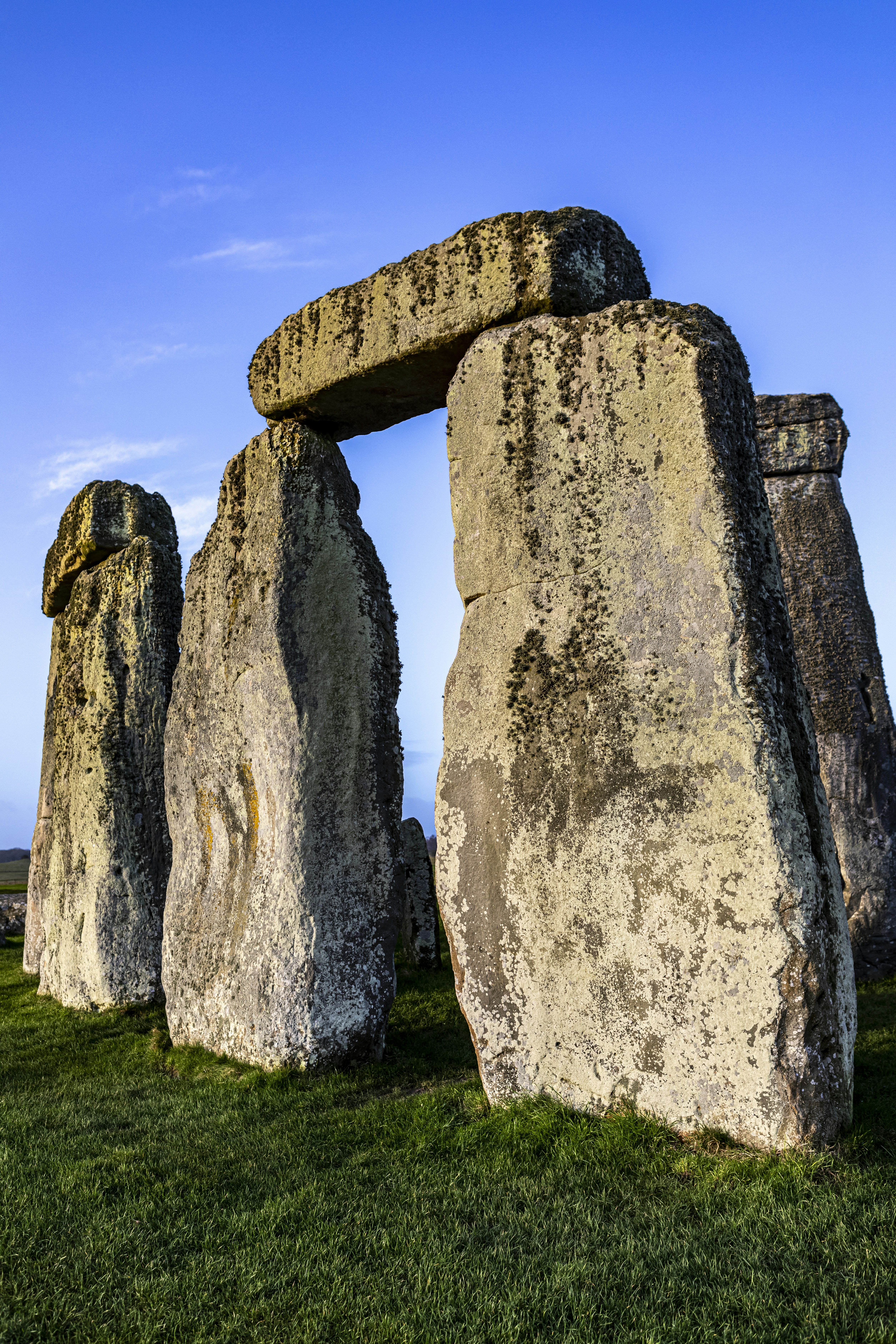 Prehistoric ritual site of Stonehenge with monliths - large stone slabs in rural England, UK. February 2020. Sunrise time.
