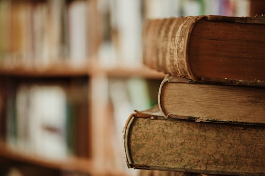 brown wooden book shelf in tilt shift lens