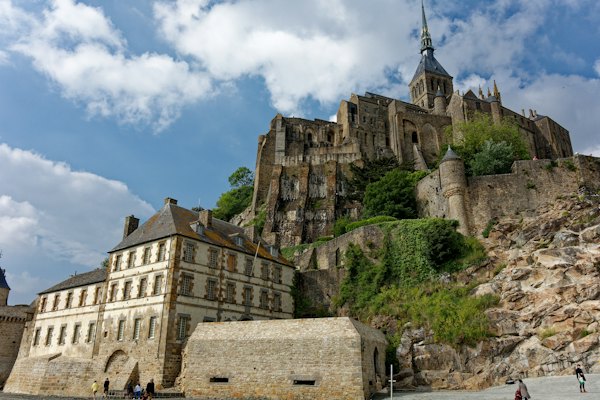 The walls, the defence tower and the abbey spire close up — Mont-Saint-Michel, France