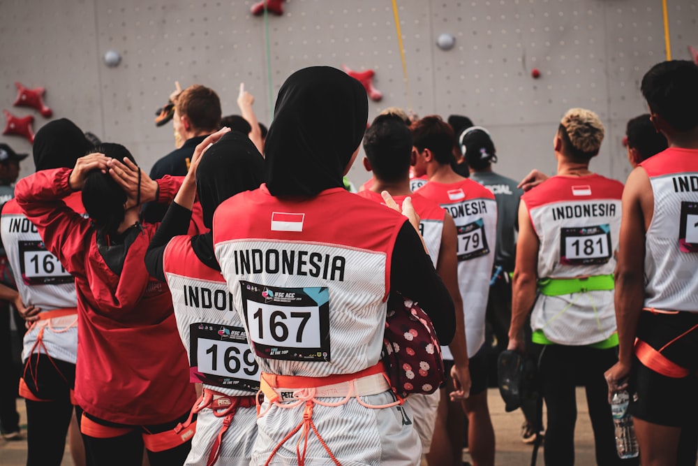 people in red and white jersey shirt