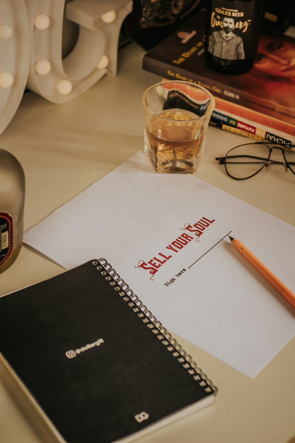 clear drinking glass beside white ceramic mug on white table