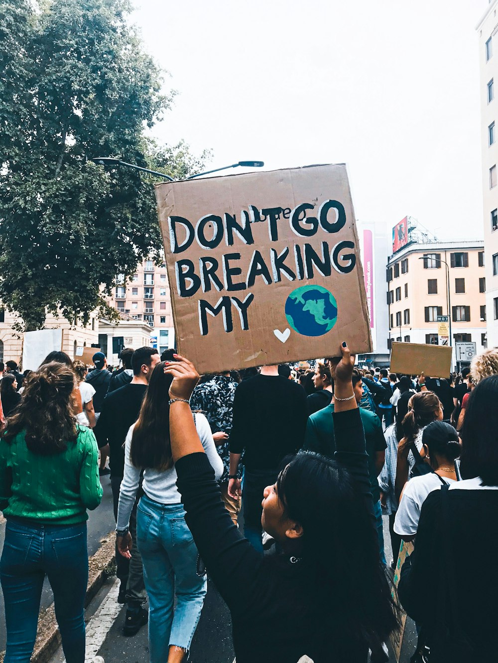 people holding white and black poster