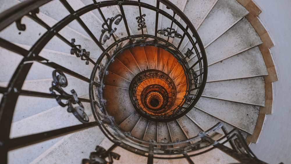 black metal spiral staircase with black metal railings