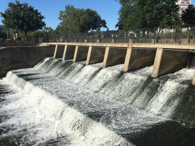 Water flowing over the Rockford dam on the Rogue River in downtown Rockford, Michigan