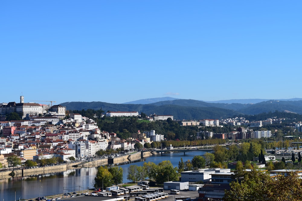 city buildings near body of water during daytime