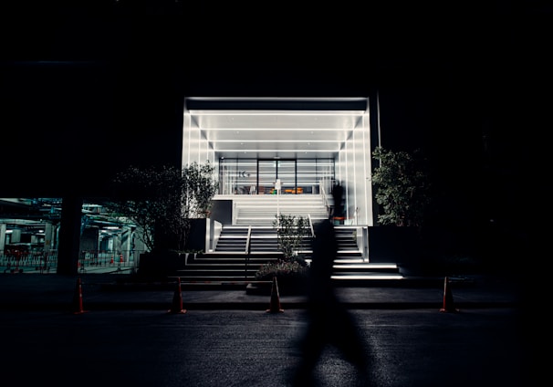 white wooden bench near glass window