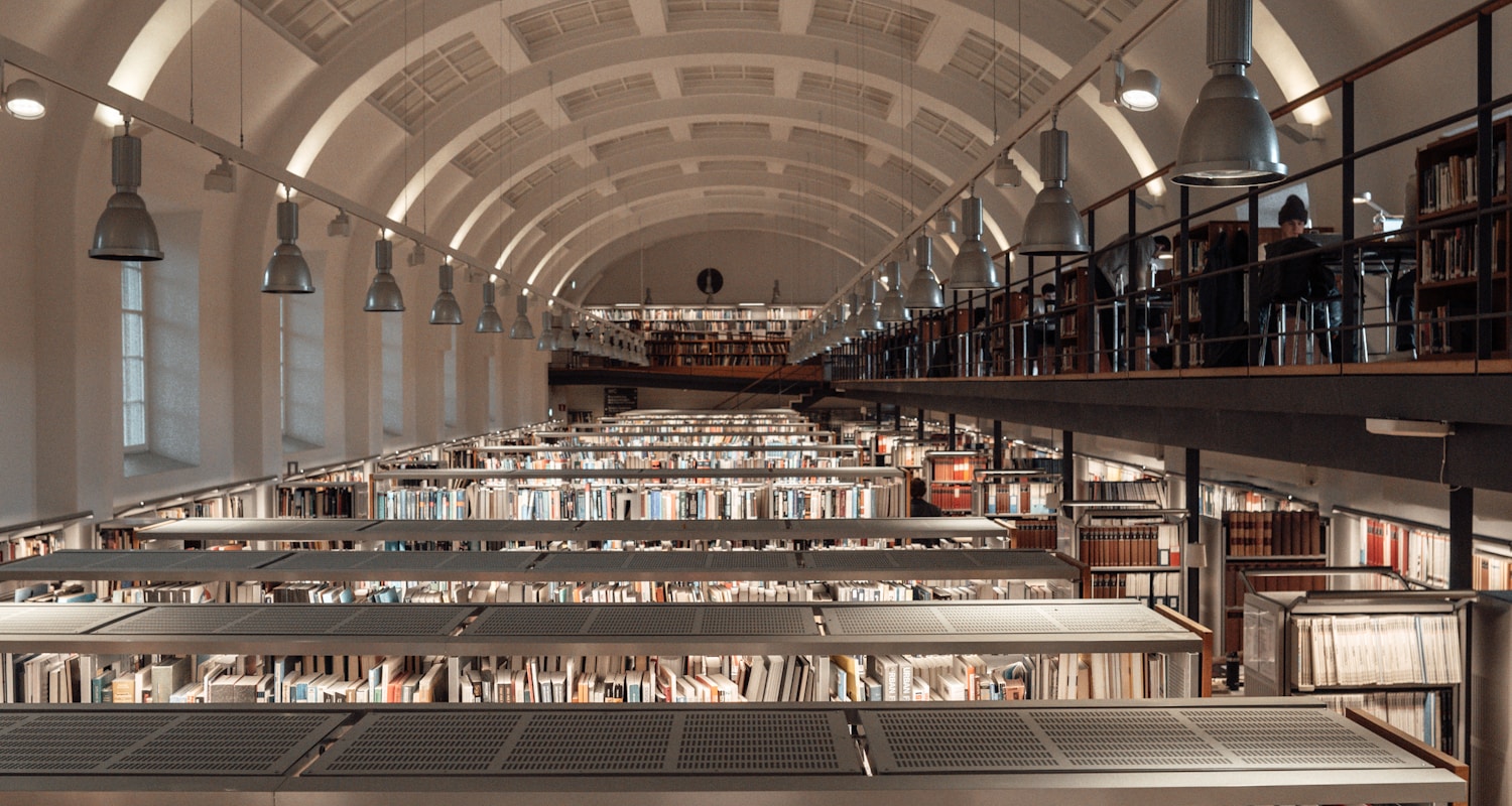 people walking inside library during daytime