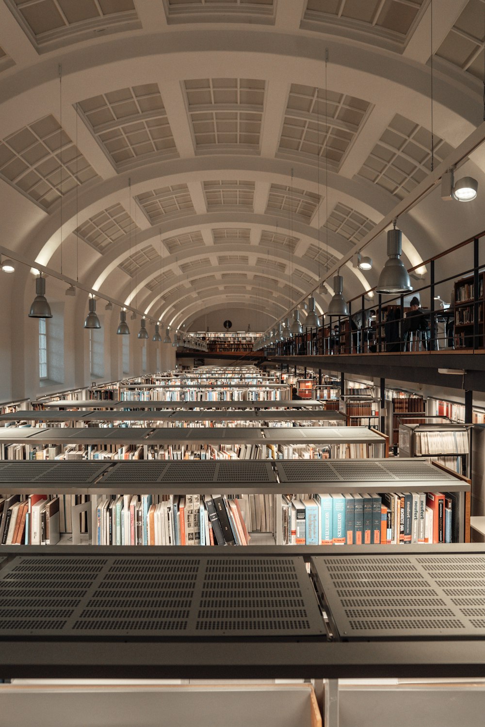 people walking inside library during daytime