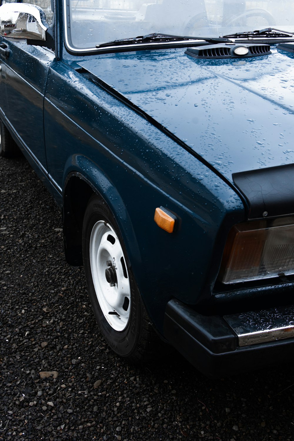 blue car on black asphalt road