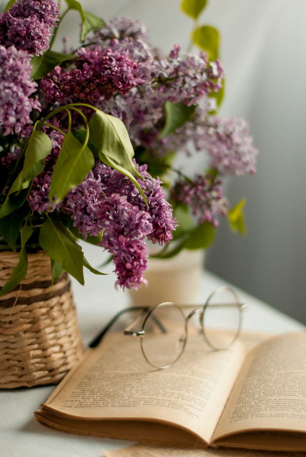 purple flowers on brown woven basket