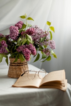 purple flowers on brown woven basket