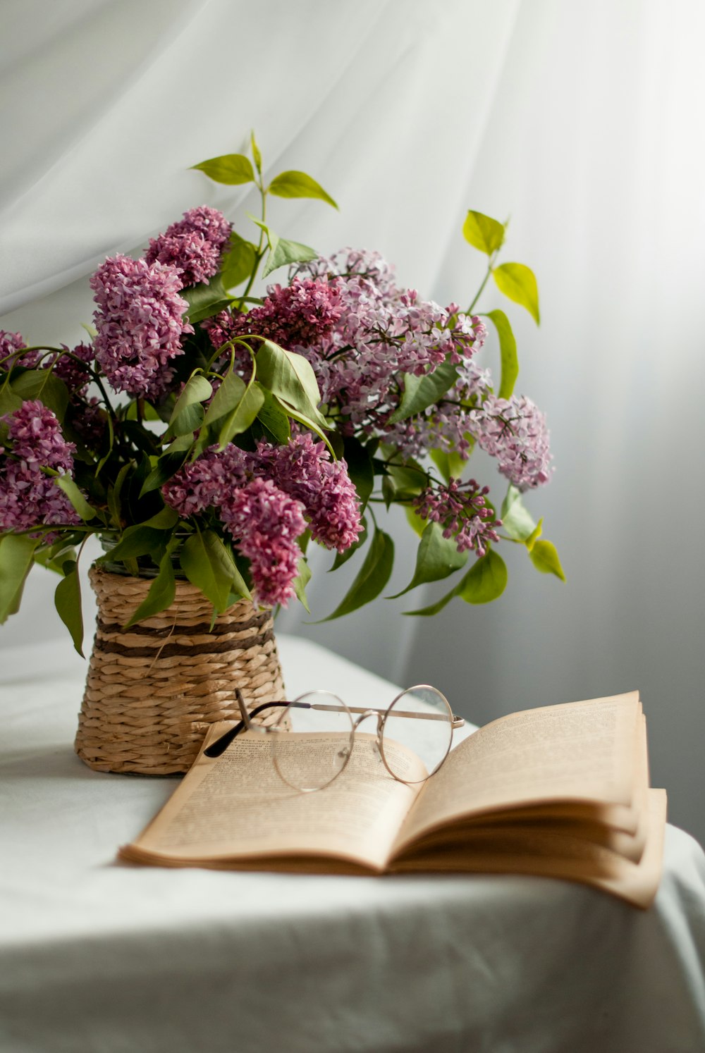 purple flowers on brown woven basket