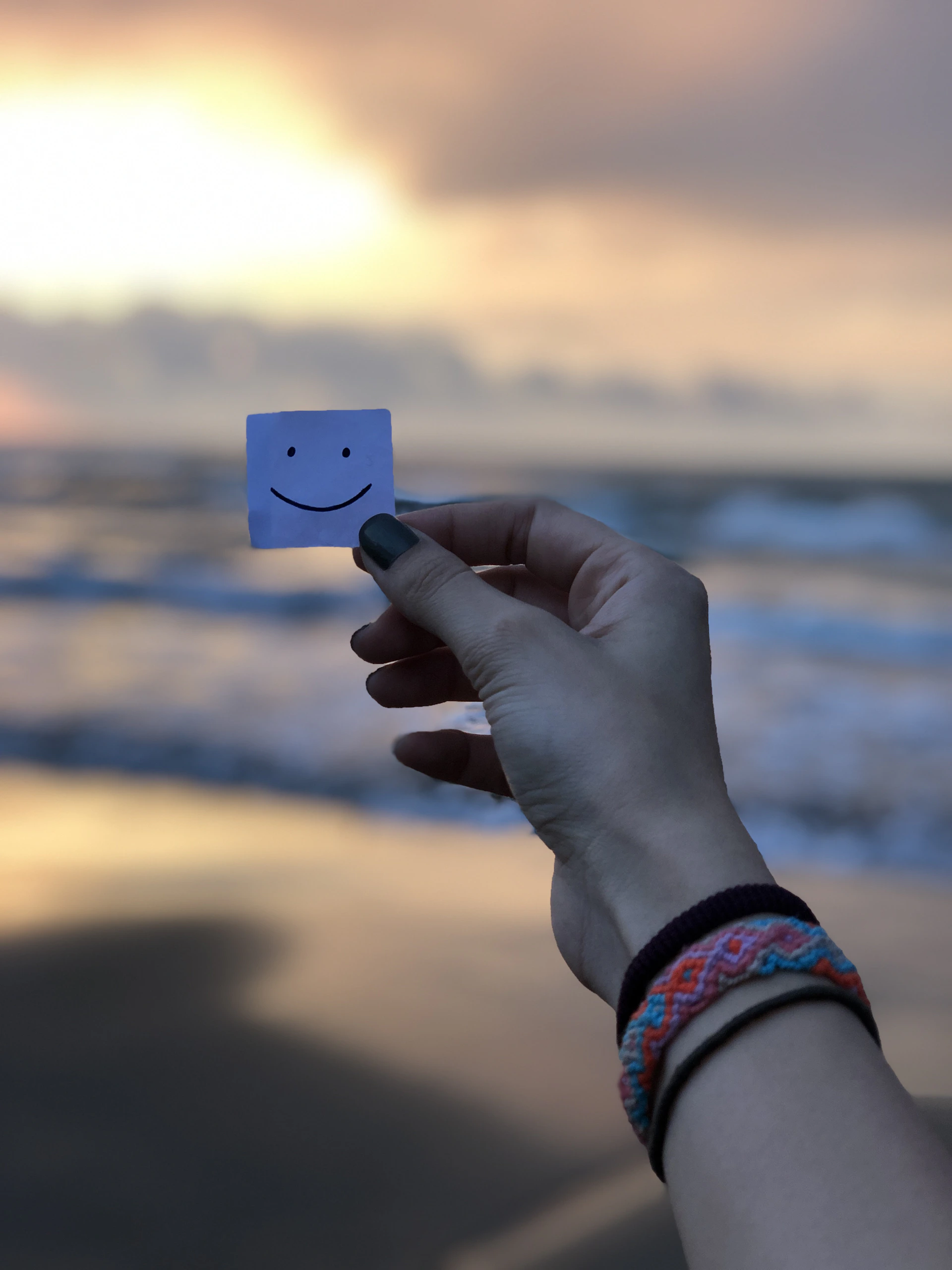 person holding blue and white card