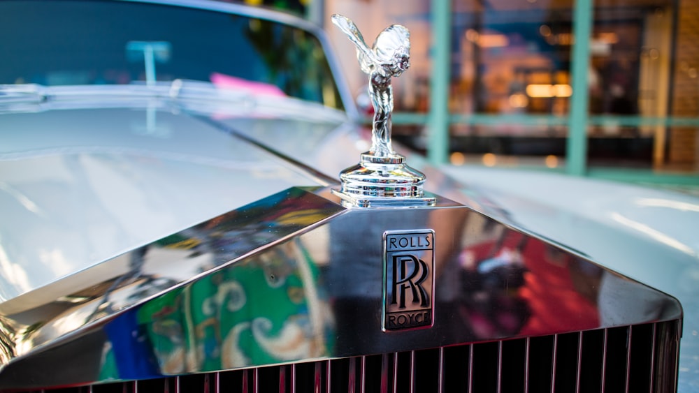 a close up of the hood ornament on a classic car