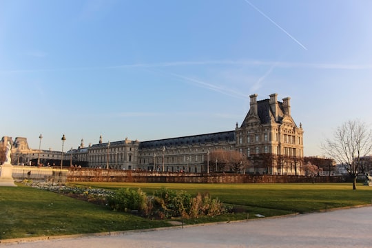 brown concrete building under blue sky during daytime in Tuileries Garden France
