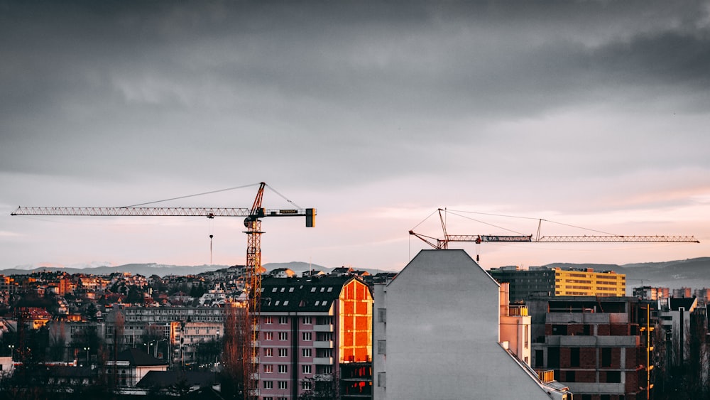 orange and gray concrete building under gray clouds during daytime