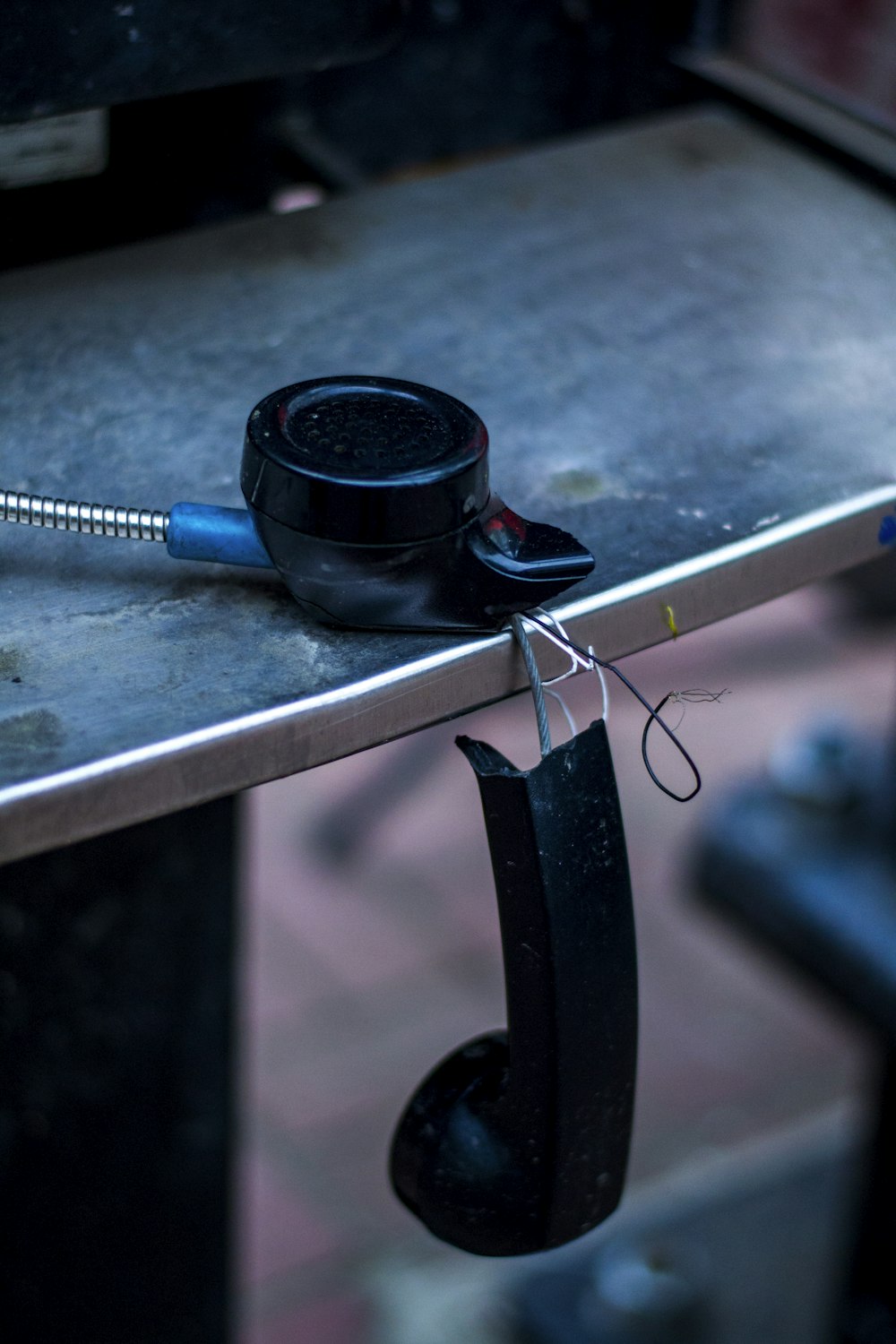 a metal table with a cell phone on top of it