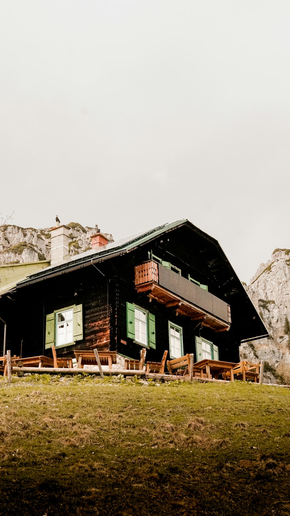 brown wooden house near trees during daytime