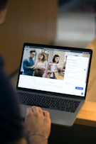 macbook pro on brown wooden table
