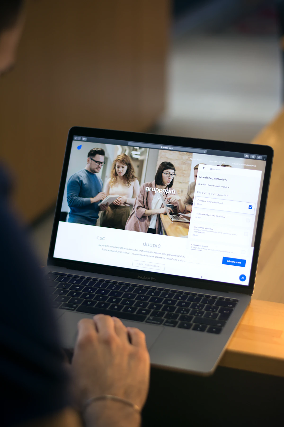 Small business owner comparing website platform options on a laptop
