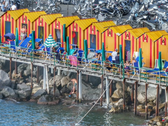 houses near body of water during daytime in Sorrento Italy