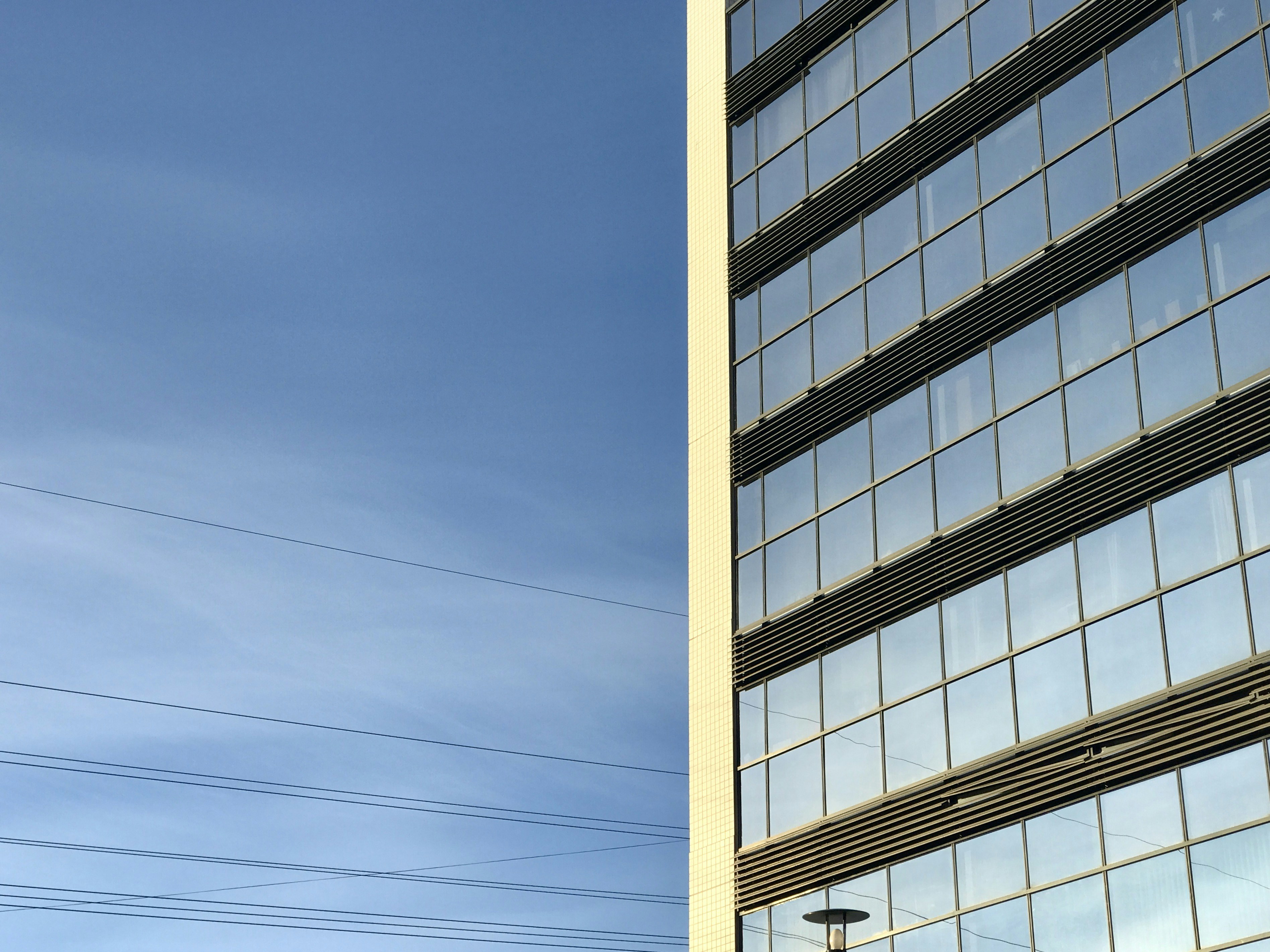 white and black concrete building under blue sky during daytime