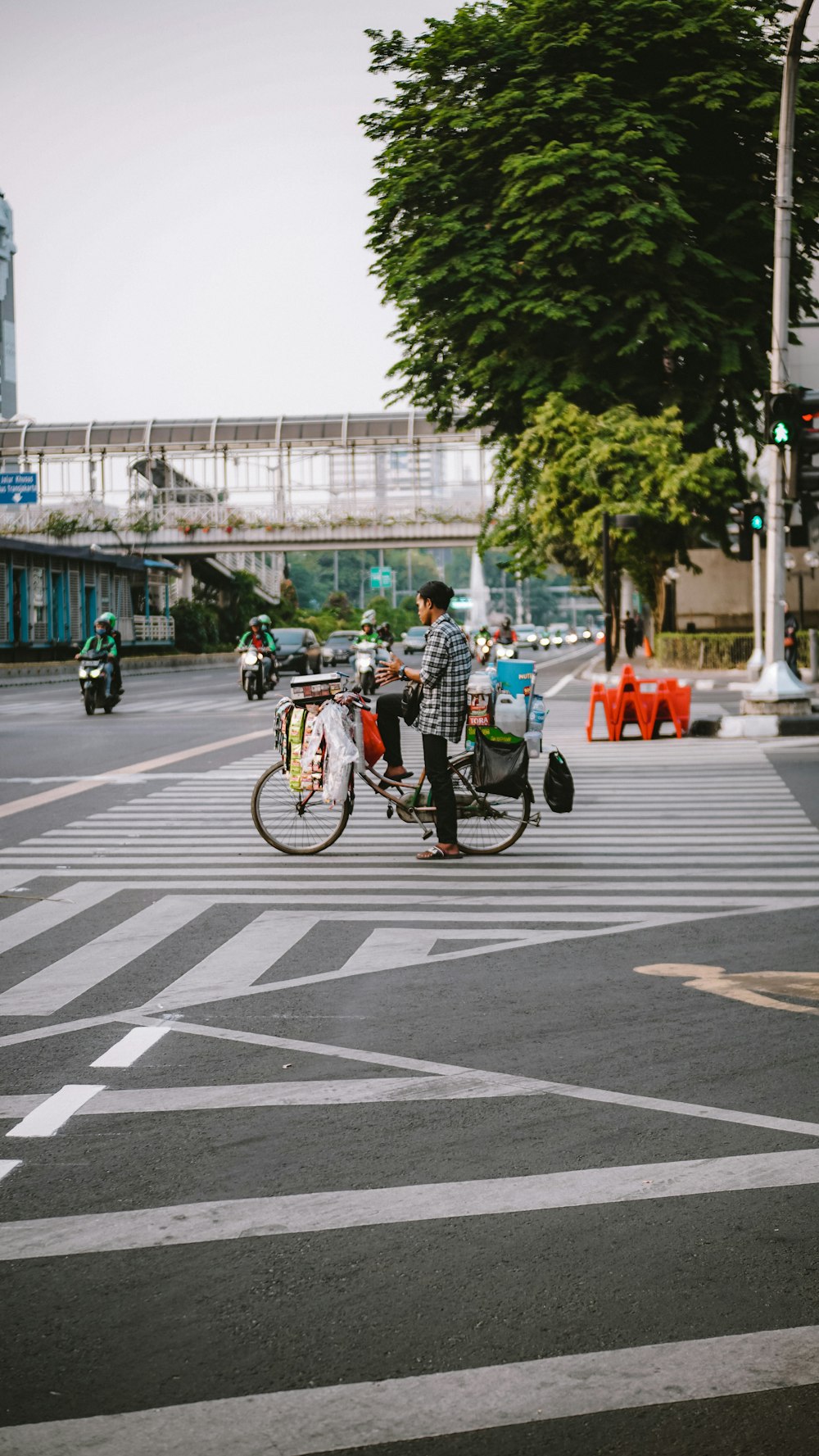people riding bicycles on pedestrian lane during daytime