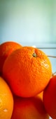 orange fruit on white table