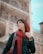 woman in red scarf and black long sleeve shirt