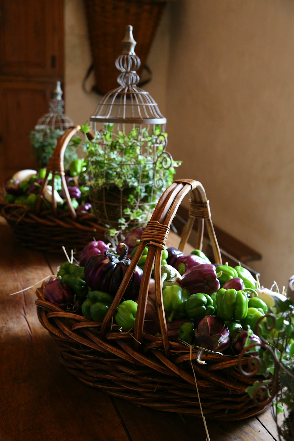 brown woven basket with green and purple flowers