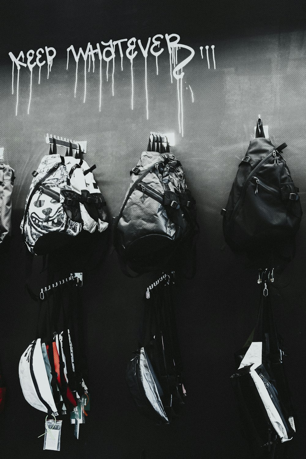black leather backpack hanged on wall