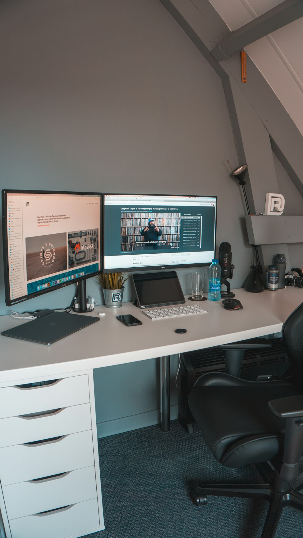 black flat screen computer monitor on white wooden desk