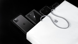 black iphone 7 on white macbook