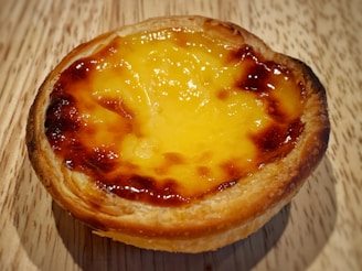 Artisan tart with a golden crust and rich, creamy filling, photographed with soft natural light.