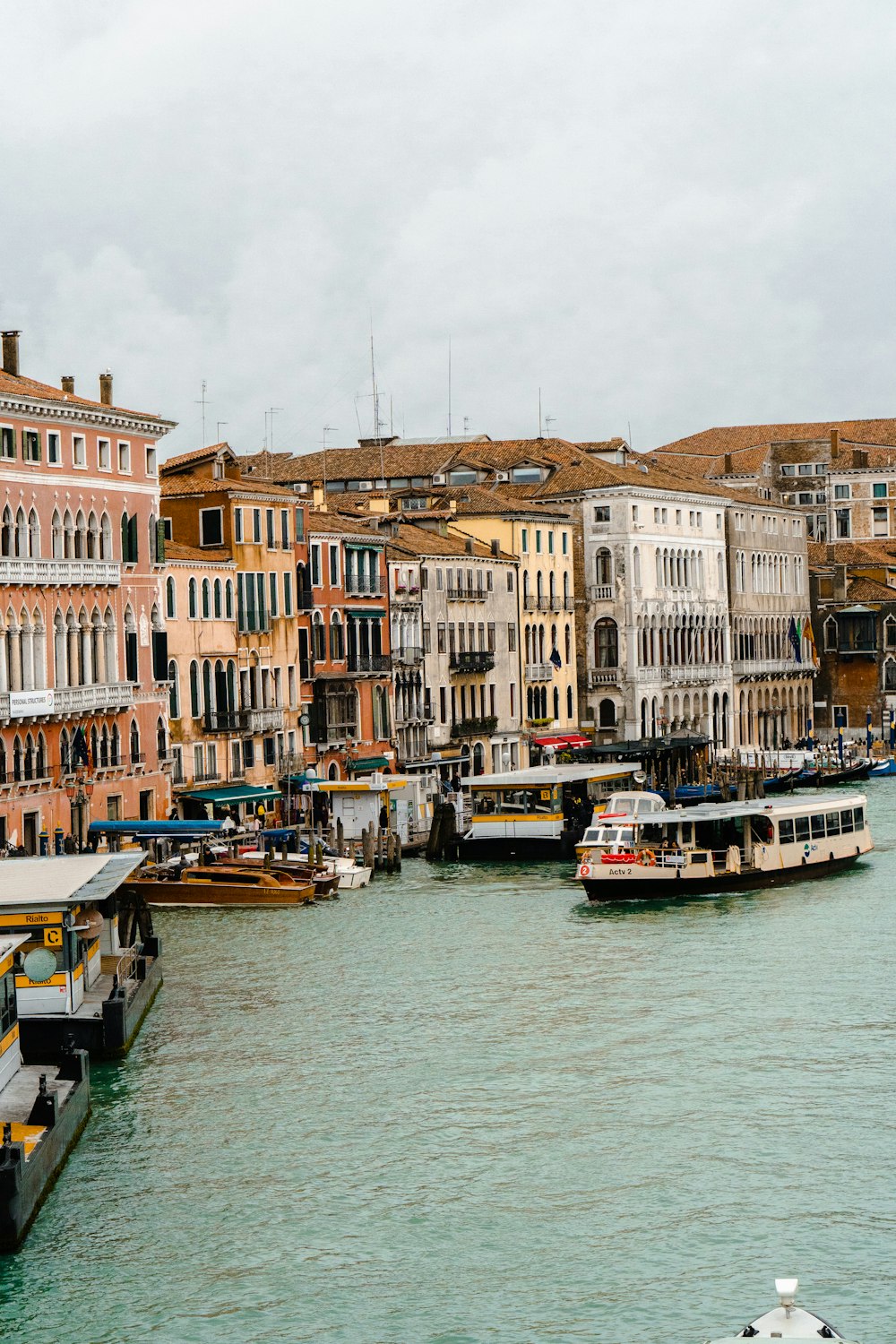 boat on water near buildings during daytime