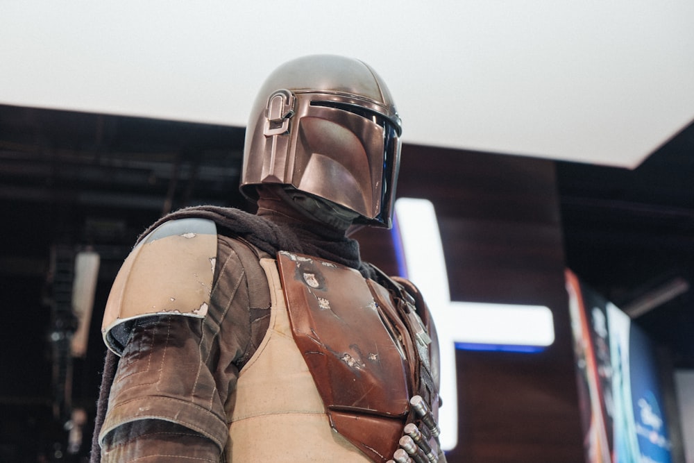 person in gray helmet and brown vest