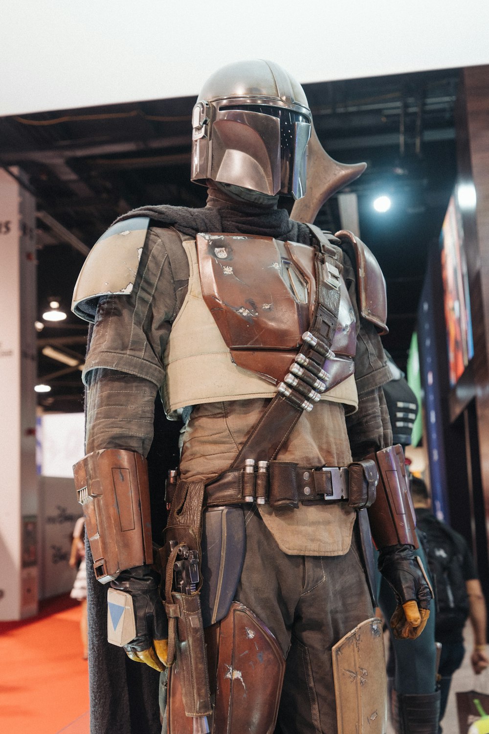 man in brown and black leather vest