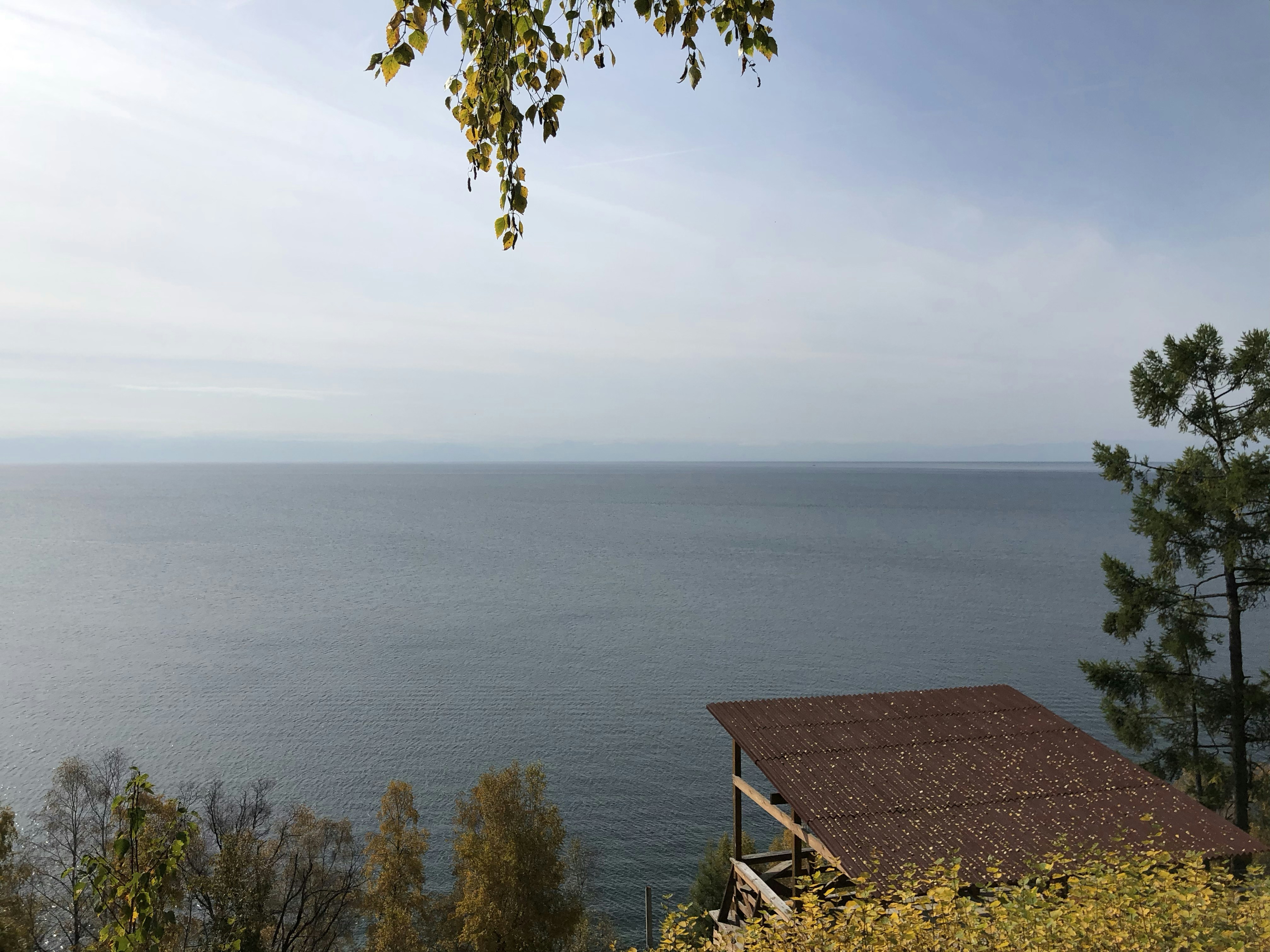 Brown wooden house near body of water during daytime photo – Free ...
