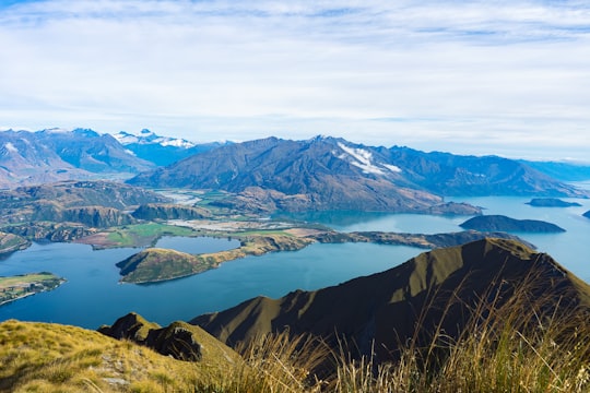 snow covered mountains during daytime in Roys Peak New Zealand