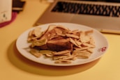 A plate of assorted snacks next to a tablet showing a starlight character video.
