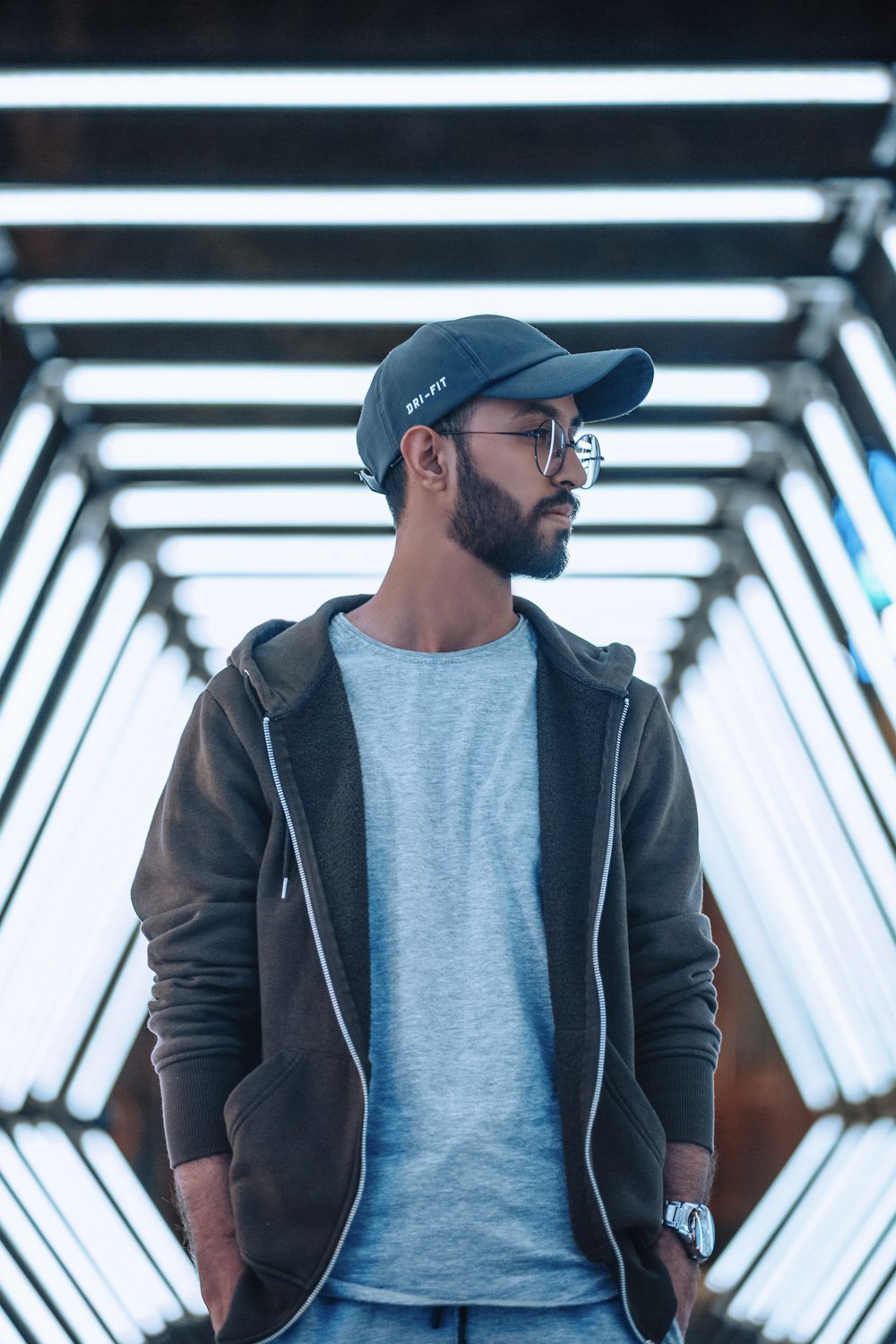 man in black leather jacket and black fitted cap