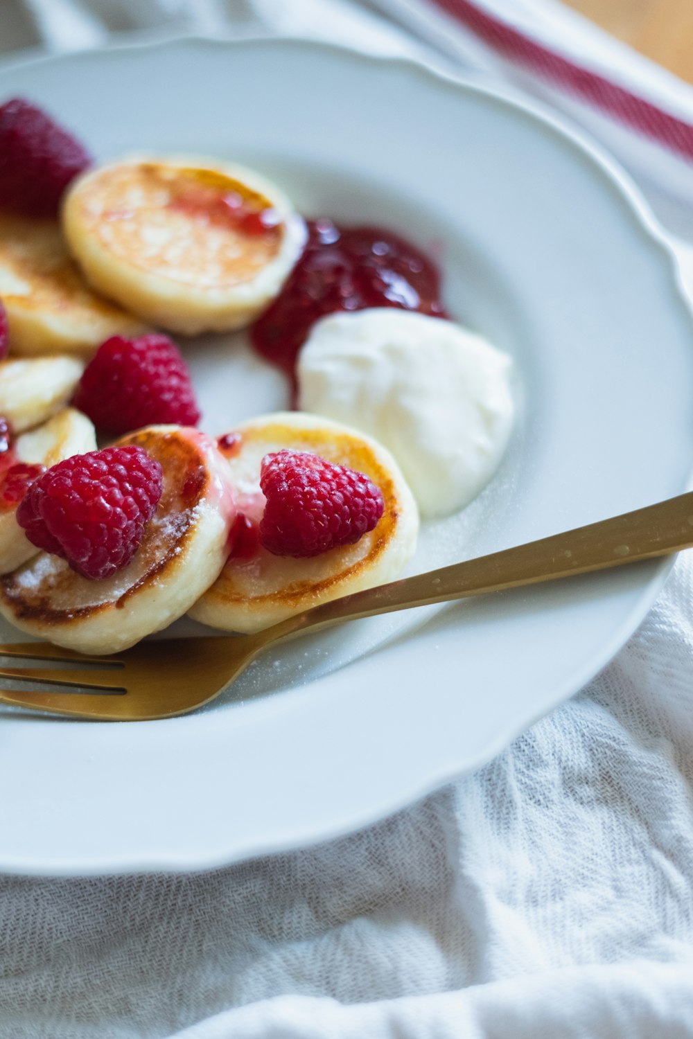 sliced strawberry on white ceramic plate