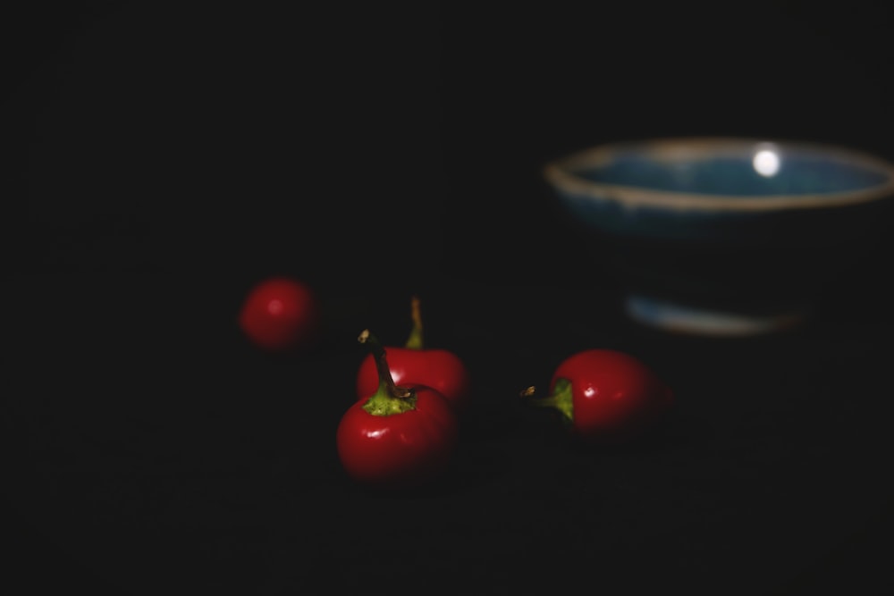 red tomato fruit on black table