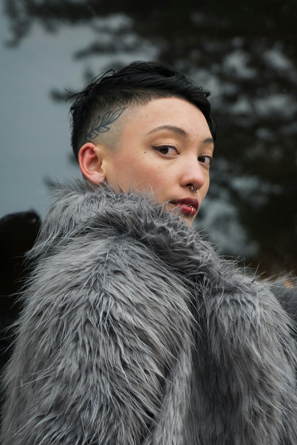 woman in gray fur coat