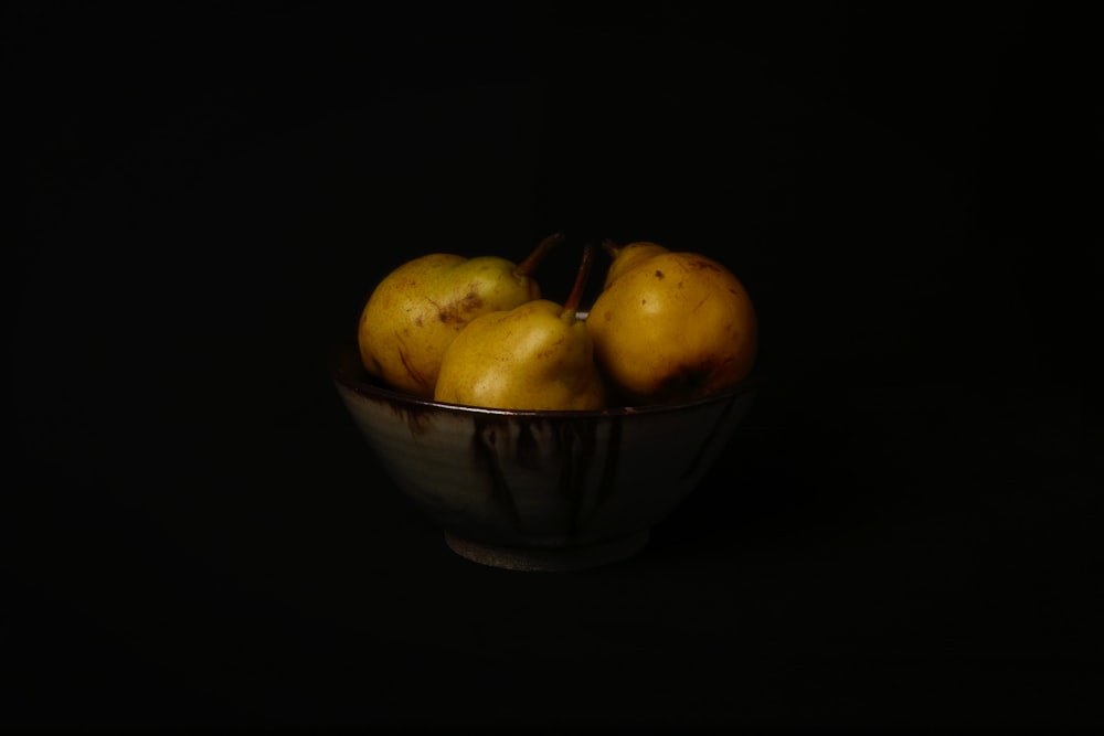 yellow and green apples in stainless steel bowl