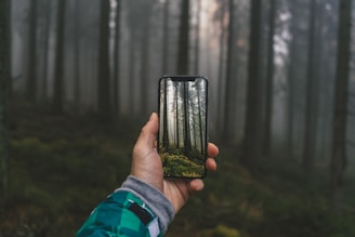 person holding black ceramic mug