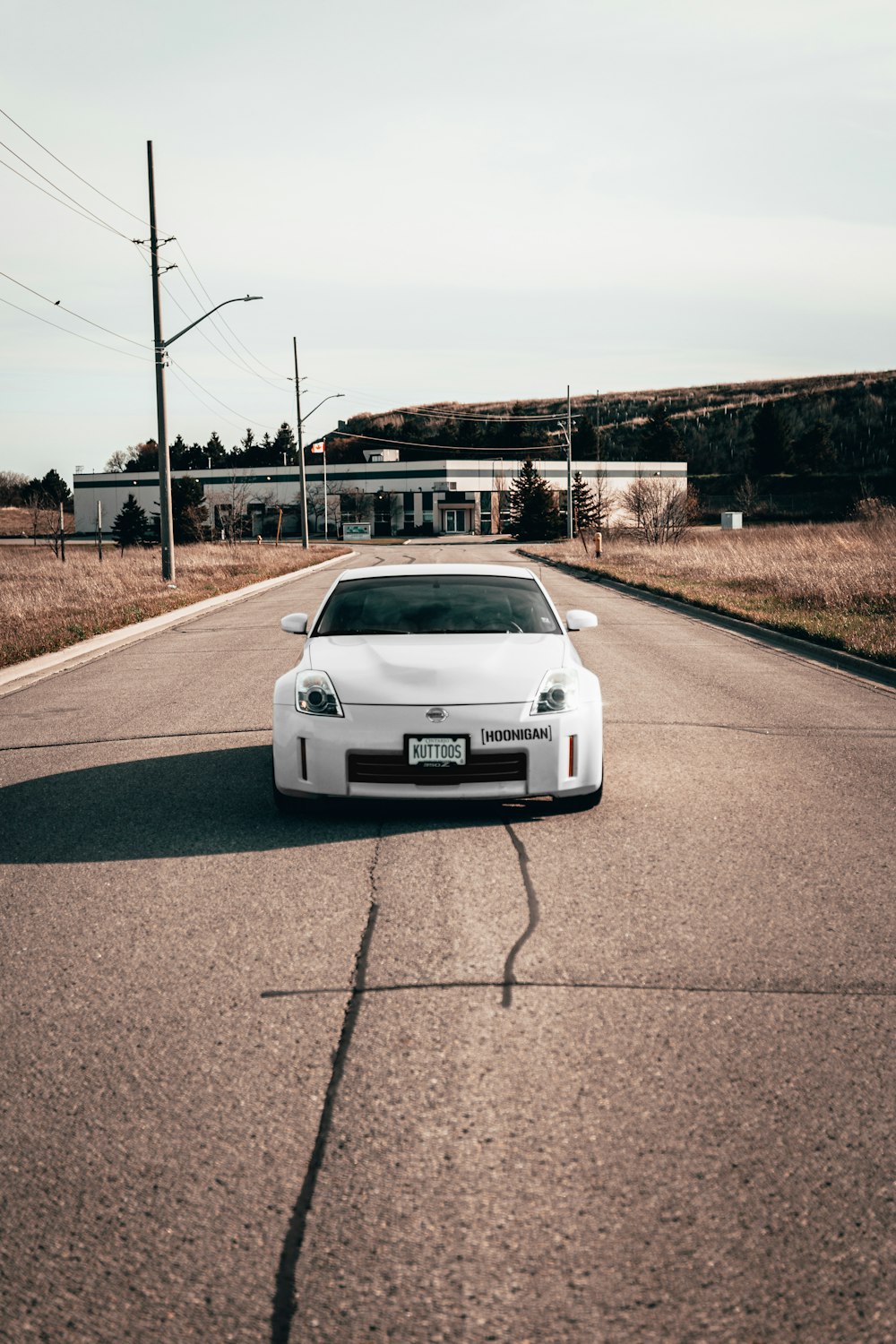 white car on road during daytime